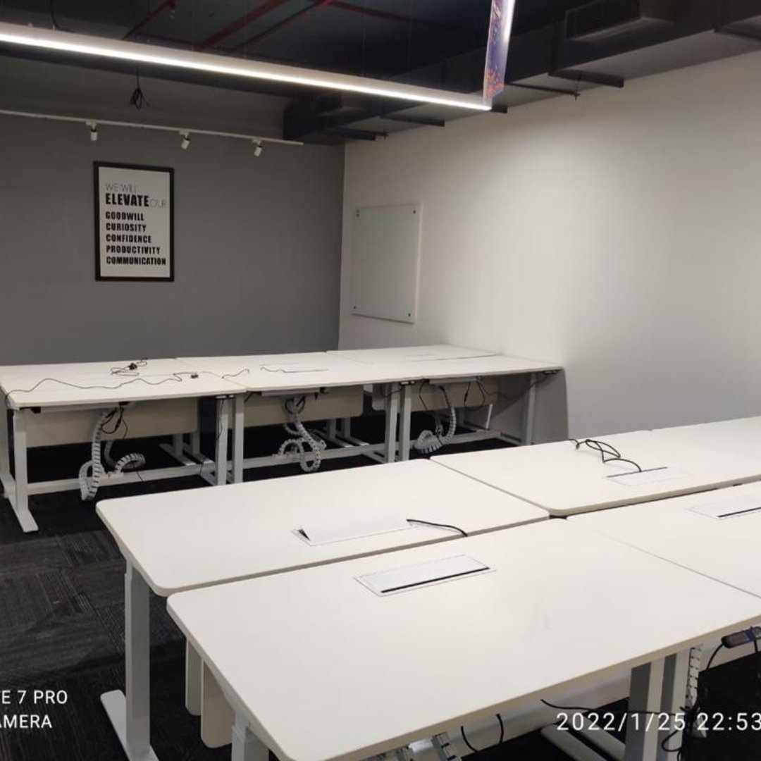 What is the purpose of a height adjustable office table? - Purpleark